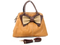 Bow accent dual compartment fashion handbag. Adjustable shoulder strap included. Back zipper pocket.
