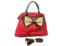 Bow accent dual compartment fashion handbag.  Adjustable shoulder strap included. Back zipper pocket.