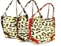 Designer Inspired Shoulder Bag has a squared design featuring a top zipper closure and a single strap. Bag has an animal print patter design and a single color belted frame. Made of faux leather.