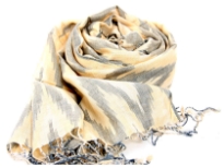 This lemon colored viscose scarf has artistic zig-zag like woven pattern in grey color. Thin twisted fringes at the ends of the scarf. Imported.