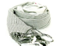 Ivory colored scarf has dark green stripes in different sizes with threads like fringes on the edges. Imported. Hand wash.