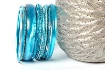 This 14 piece set of hand crafted bangles have skinny as well as wide cuff bangles in resin material. Each bangle has its own etched design or is plain & simple. Lightweight & stylish set of fashion bangles can be matched with lot of outfits.