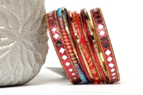 Chic & trendy assorted 11 pieces set of hand crafted fashion bangles consists of 2 wide glittery bangles with mirror pattern, 1 red glittery bangle, 1 colored thread bangle, 4 thin red & 4 thin gold bangles. Can be matched with number of outfits to give that edgy look.