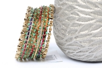 Bohemian Gold Metal Fashion Bangles Set in assorted designs. Set includes 2 metal floral pattern bangles, 6 wavy pattern bangles with green beads, 3 thin multi colored bangles & 2 thin gold bangles. Colorful set can be matched with number of outfits & are very lightweight. 