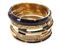 Very beautiful & trendy 11 pieces set includes one wide black bangle, one metal patterned bangle, 2 painted bangles, 3 thin gold colored bangles, 3 thin black beads bangles & 1 floral pattern bangle. Hand crafted in India.