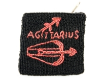 Hand Beaded coin purse. Top zipper closing.