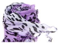 Cow print in black over 100% viscose scarf in shades of purple & lilac. Threads like long fringes on the ends of the scarf. Imported.
