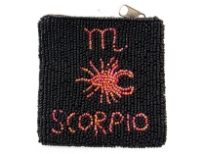 Hand Beaded coin purse. Top zipper closing.