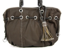 PVC Fashion Handbag which is spacious, has braided double handle, hanging braided accent in the front & drawstring accent at the neck of the bag.
