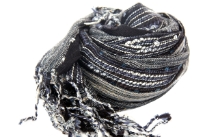 Beautiful black and multi colored design scarf has horizontal open weave pattern. Long twisted fringes completes this 100% viscose scarf. Classy scarf can also be teamed up with a formal dress as a shawl. Imported.