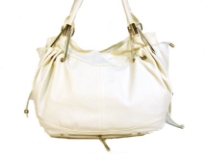 Designer Inspired Shoulder Bag has a top zipper closure and a double handle. Zipper detail at the bottom. Made of PU (polyurethane).