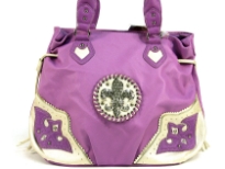 Fleur De Liz Licensed Handbag in Shining PVC. Bag has patchwork design in the corners in contrasting color. Double handle & hanging fringes on the sides of the bag. Top zipper closure. Fleur De Liz logo in center with rhinestones on it. 