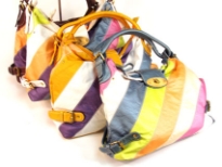 Designer Inspired Hobo Handbag has a single double strap, a twist lock closure and a metallic multi color stripes pattern. Made of faux leather.