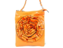 Crossbody bag has a top zipper closure, a detachable strap and a large flower detail. Made of faux leather.