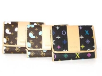 Authentic XOXO Designer Inspired. Small size wallet with logo pattern and snap closure. Made of faux leather.