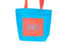 Jute tote bag has a USA label and double shoulder straps.