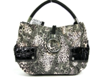 Animal print Fur fashion handbag embellished with a top zipper closure with a hanging bracelet handle and a single shoulder strap. Outer bold compartments also accentuate this bag.