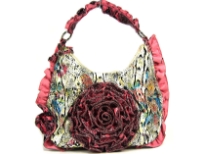 Designer Inspired Snake Print in Multi Colors PVC Hobo Handbag with big floral applique, has a single strap and a zipper closure. Gathered trim borders the handle and the sides of the bag.