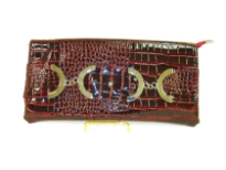 Croco embossed PVC clutch Bag has metal details and a magnetic closure and a an inside zipper closure.