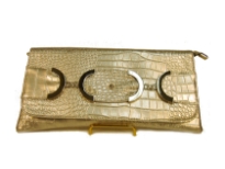 Croco embossed PVC clutch Bag has metal details and a magnetic closure and a an inside zipper closure.