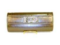 Fashion Clutch Bag has a glossy texture and a studded logo. Magnetic closure. Made of PVC.