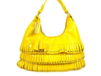 PVC fashion Hobo Handbag has studded details has a metallic texture, a top zipper closure, and a single strap. Made of faux leather.