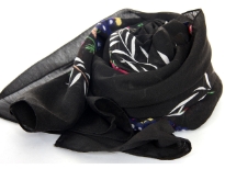 100% polyester scarf in floral design. Main color in Black. Hand washable. Size is approximately 72x40 inches. Made in India.