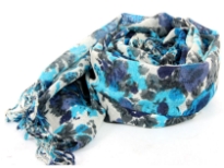 Venetian Blues saturate the lush floral print on a super soft, fringed wool scarf in Ivory color. Imported. Dry clean only.