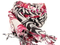 This beige colored wool scarf has alternate waves of leopard and zebra print pattern in black & fuchsia colors with little bit of floral print also. Long twisted fringe at the edges. dry clean only. Imported.