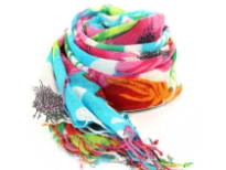 A garden of fresh flowers blooms on the fine wool weave of this vibrantly colored scarf finished with twisted long fringe at the edges. Imported. Dry clean only.
