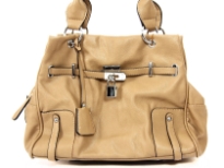 Fashion Handbag has a double handle, a top zipper closure and a belt and lock detail. Made of PU (polyurethane).