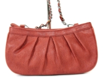 Fashion handbag has a top zipper closure, a chain shoulder strap and a floral print pattern. Made of PU (polyurethane).