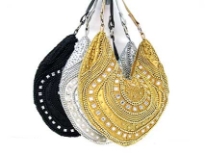 Beautiful hand beaded evening bag with mirrors & beads of different shapes. Top zipper closing with single shoulder strap.