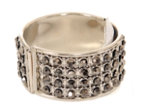 Metal Folding Bracelets with Silver Colored Kundan Work. 12 similar pieces in a box. Imported.