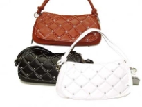 Designer Inspired Handbag has a checkered pattern with studded details. Bag also has a single strap. Made of faux leather.