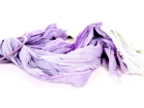 Crinkled Two Tone Woven Polyester Scarf with eyelash fringes all around it. Soft and lightweight to use & comes on a small round hanger. Imported. 100% polyester.