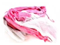 Crinkled Two Tone Woven Polyester Scarf with eyelash fringes all around it. Soft and lightweight to use & comes on a small round hanger. Imported. 100% polyester.