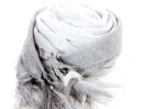 This lightweight 50% viscose & 50% polyester scarf in grey, silver & white shades with silver stripes running through it can be used all year around to give an edge to your outfit. Long knotted tussels on its edges. Imported.