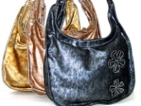 Designer Inspired Two Tone Shoulder bag has a metallic texture, a top zipper closure, a single handle and floral details. Made of faux leather.