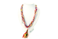Colorful satin thread braided with small colored resin beads has 4" chain on both ends with lobster closure. A 3.5" long hanging threads, beads & chains accent completes this funky neck piece.
