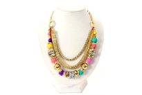 Chunky resin & wooden beads in different sizes & pattern decorate the longest strand in this necklace. one is thick rounded mesh metal chain & third is also a patterned metal chain. All 3 are hanging from a round ring on each side. Imported.