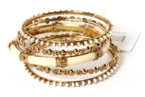 Gold and Ivory metal with Resin bangle bracelets. This is a set of 4 bangle bracelets. This will fit a small-medium sized wrist.