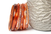 This 14 piece set of hand crafted bangles have skinny as well as wide cuff bangles in resin material. Each bangle has its own etched design or is plain & simple. Lightweight & stylish set of fashion bangles can be matched with lot of outfits.