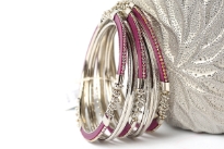 Beautifully hand crafted 9 pieces set of stylish bangles includes 3 purple colored resin bangles encrusted in silver colored metal frame & 6 skinny bangles either etched or plain. Rich color of these bangles makes them attractive & reflects expertise to craft them. Fits small to medium size wrist.