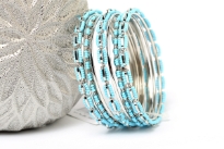 Turquoise Beads Silver Metal Fashion Bangles Set can add zing to any kind of outfit. Set includes 4 thin bangles, 2 petal patterned with beads and 3 bangles having beads in boxy shape. Durable & long lasting quality.