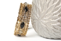 Beautiful & sturdy 5 piece fashion bangles set includes 2 thin gold colored bangles, 2 floral metal pattern bangles & one wide metal pattern bangle with black resin on it. Hand crafted & designed in India.