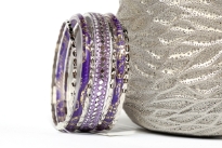 Shiny & Glittery seven piece set of fashion bangles in purple hues includes one wide bangle in Aluminium with mirrors design on it, 2 resin bangles with gold glitter inside them & 4 thin silver bangles. Hand crafted in India.