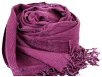 Plum colored shiny viscose scarf in Yarn dyed 95% viscose and 5% metallic material. Shimmery metallic is woven into the scarf & gives an edgy look to it. Imported. Hand wash.
